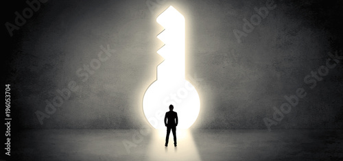 Businessman standing in a big keyhole