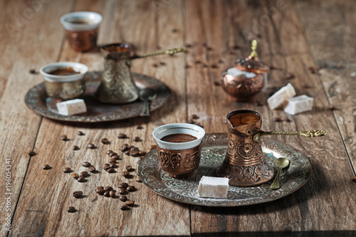 Oriental/Bosnian/Turkish coffee served in copper-plated pot with Turkish delight. photo