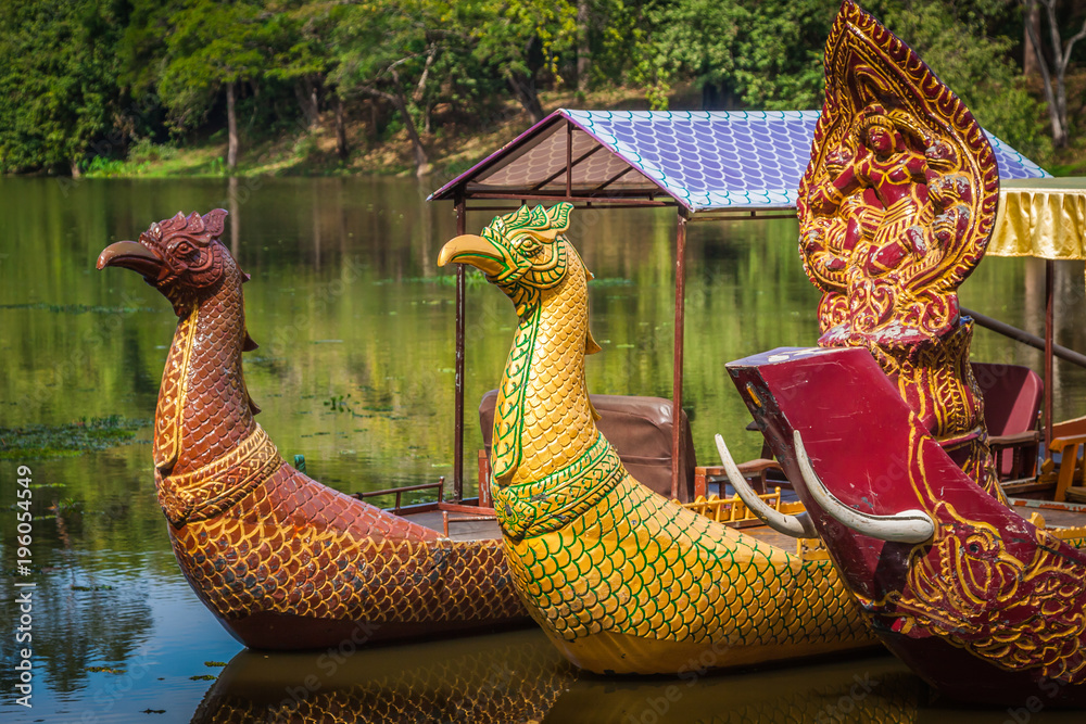 Thai traditional boats on the lake near,Bayon temple in Angkor Thom, Siemreap, Cambodia.