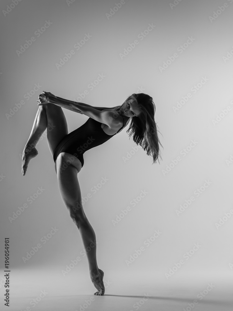 Young gymnast woman stretching and training Young gymnast woman stretching and training