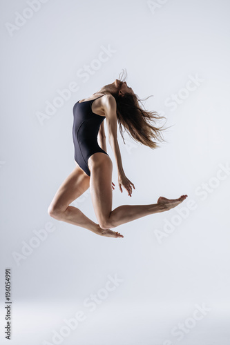 Young gymnast woman stretching and training