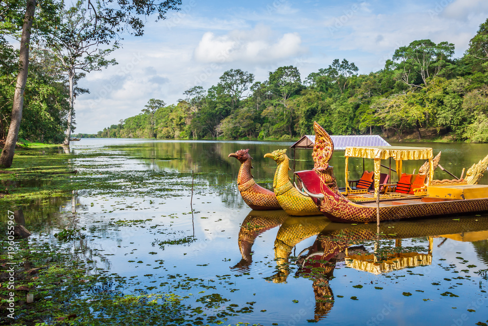 Thai traditional boats on the lake near,Bayon temple in Angkor Thom, Siemreap, Cambodia.