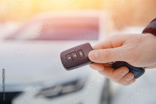 Fototapeta Naklejka Na Ścianę i Meble -  Key of car. Man holds car alarm key.