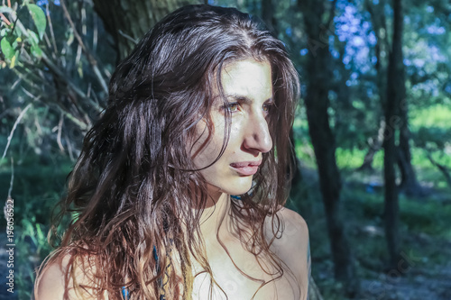 Beautiful Pagan Woman looking at the sunrise, close up