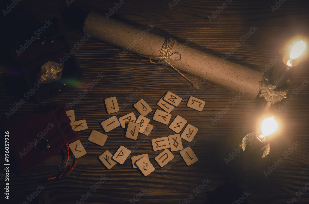 Runes scattered on the magic table of fortune teller. Scandinavian ...