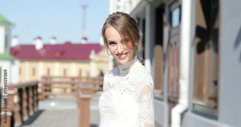Elegant girl with hairdo in white lace design dress walking smiling in street sunny spring day back. Young woman wearing festive clothing looks camera make-up skin care. Female beauty happiness
Elegant girl with hairdo in white lace design dress walking smiling in street sunny spring day back. Young woman wearing festive clothing looks camera make-up skin care. Female beauty happiness