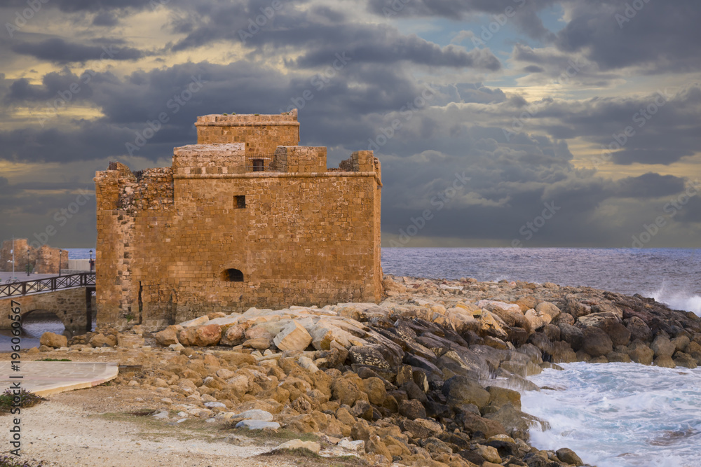 Medieval Paphos castle  on the seashore at sunset. Cyprus.