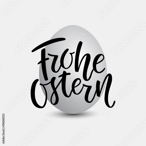 Happy Easter German text lettering calligraphy on grey egg. Frohe Ostern for Paschal greeting card. Vector on grey background. Great for poster, sticker. Brush ink modern handlettering. photo