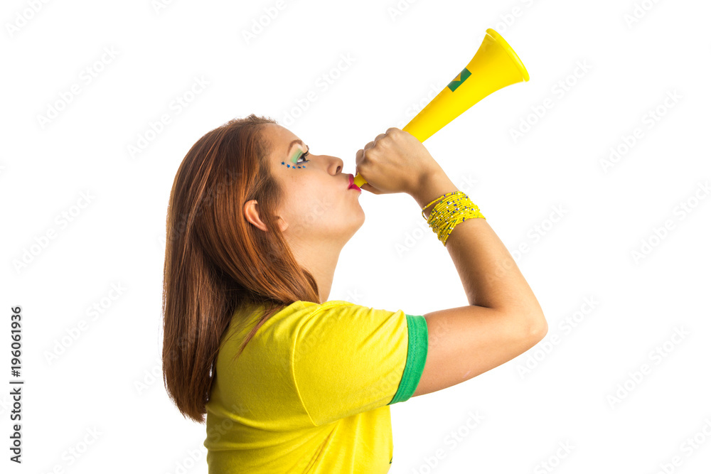 Brazilian woman fan celebrating on football match on white background. Brazil colors. Brazilian woman fan celebrating on football match on white background. Brazil colors.