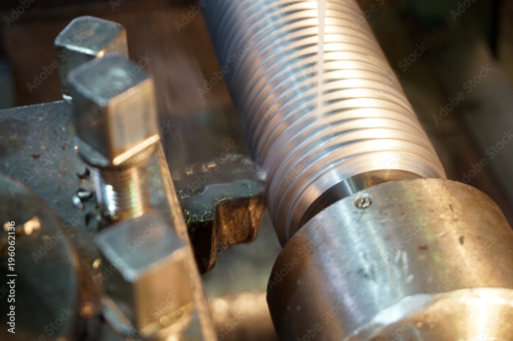 threading the shaft on the machine, a mechanical cutter threading the shaft on the machine, a mechanical cutter
