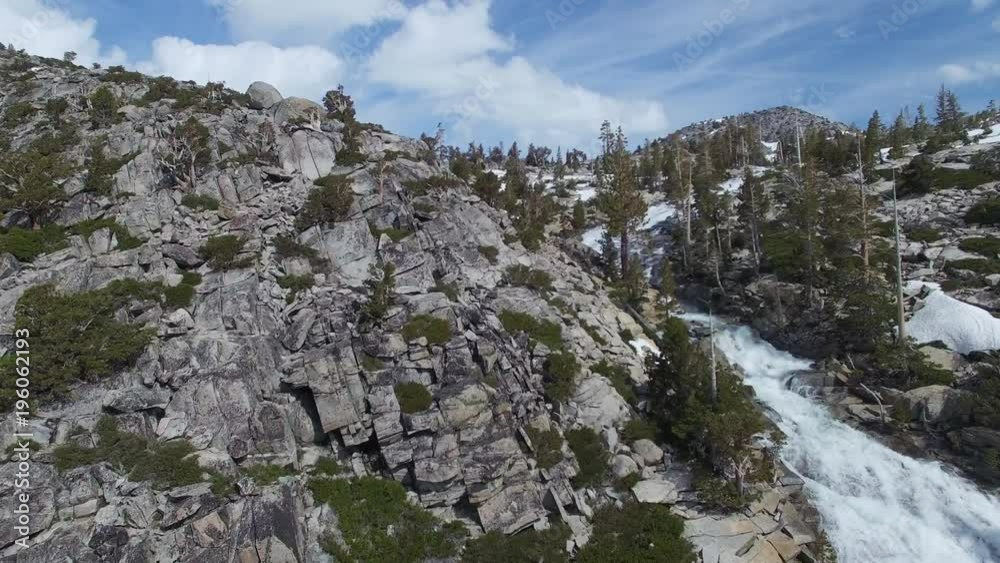 Rising Above Crest of Epic Waterfall Towards Mountain Lake Rising Above Crest of Epic Waterfall Towards Mountain Lake