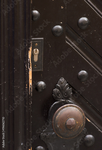 The front door closeup. Keyhole and handle