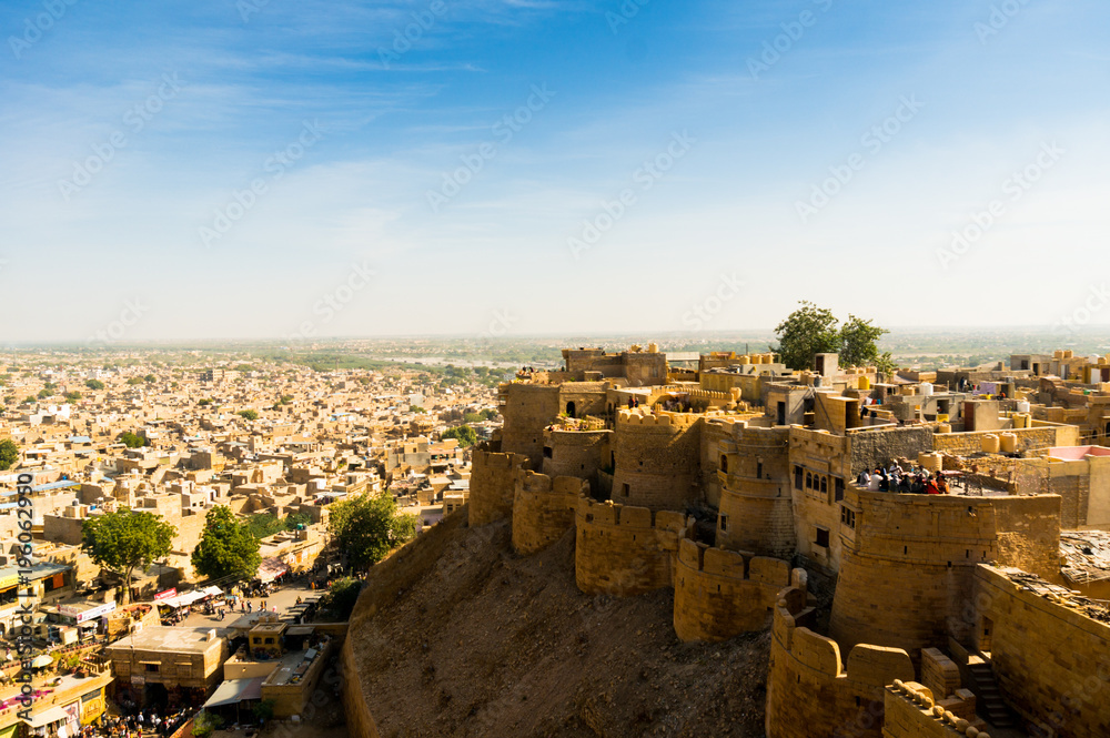 Aerial shot of Jaisalmer's famous sonar quila perched atop a mountaintop. This sandstone fort is one of the only living forts in the country and a famous tourist destination in Rajasthan India asia