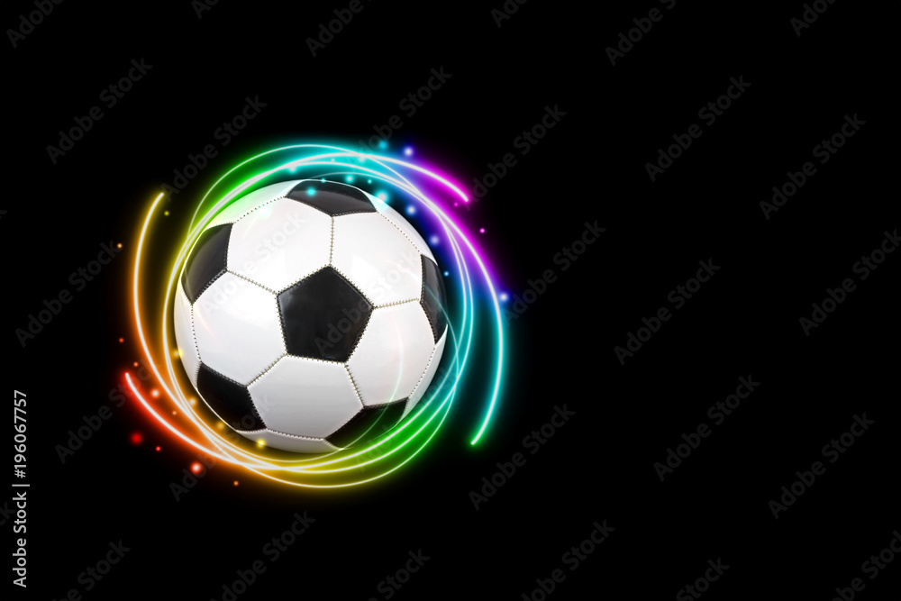 Obraz premium Soccer ball with colorful effects on black background.
