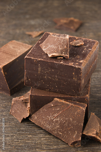 Dark chocolate on a wooden background. close-up photo