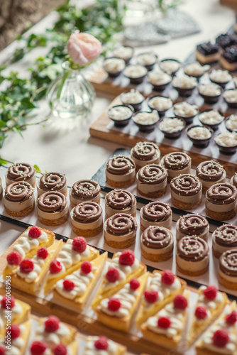 different types of sweet dessert on board, patisserie, healthy cakes