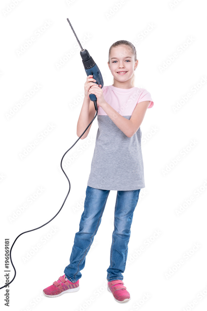Portrait of a young girl holding an electric drill in the hands isolated on white background Portrait of a young girl holding an electric drill in the hands isolated on white background