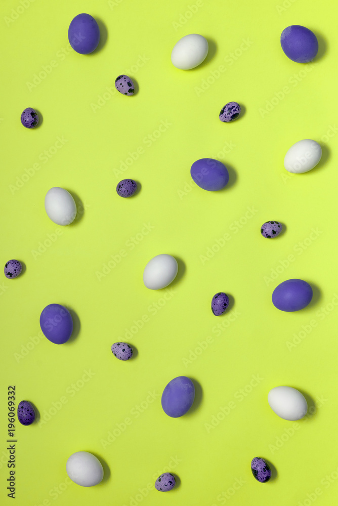 Chicken eggs and quail eggs on green background, copy space. Healthy food concept. Top view, flat lay. Easter eggs. Happy Easter concept