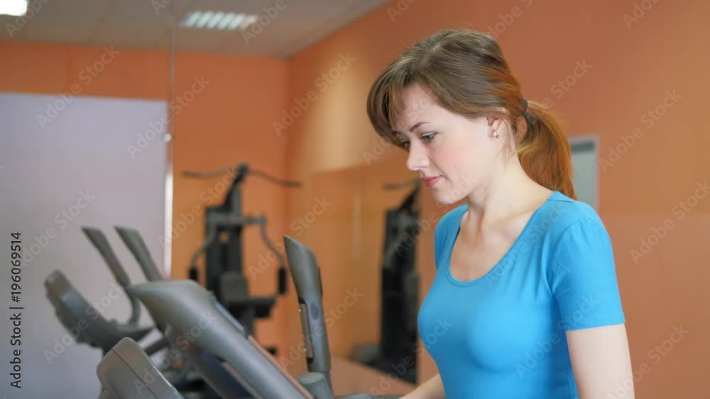 Sports Hall. Girl is training in the gym. Sports Hall. Girl is training in the gym.