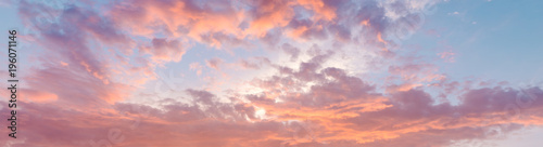 Fiery orange, pink and blue very beautiful sunset sky. Dramatic clouds after rain