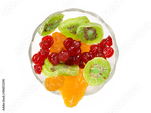 Isolated different dried fruits on a plate.