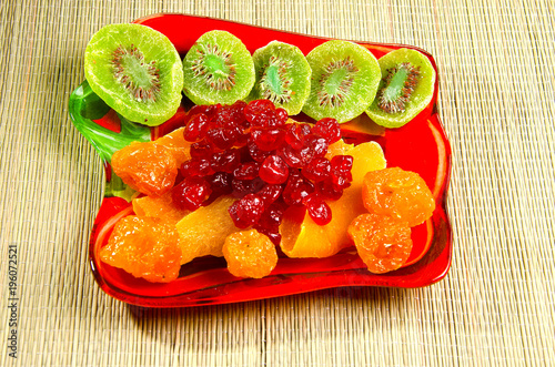 Different dried fruits on a plate.