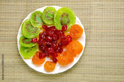 Different dried fruits on a plate.
