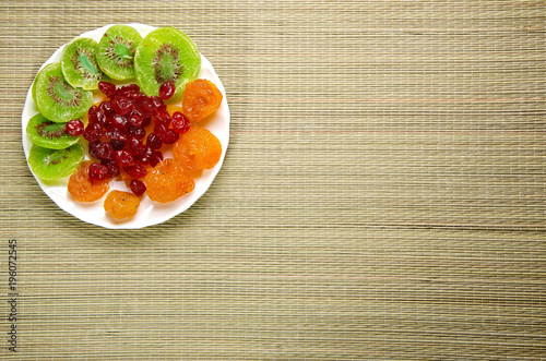 Different dried fruits on a plate.
