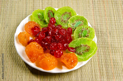 Different dried fruits on a plate.