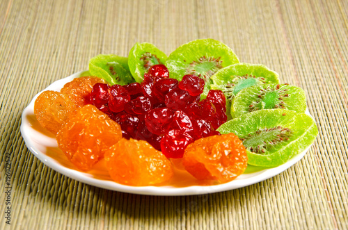 Different dried fruits on a plate.