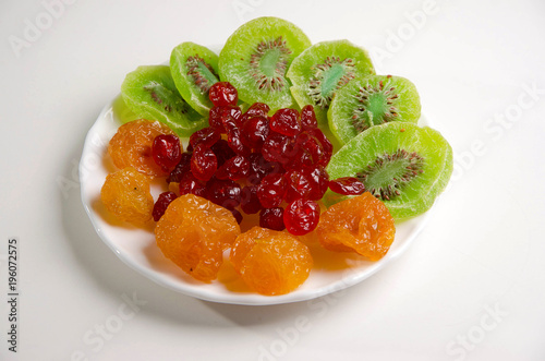 Different dried fruits on a plate.