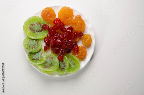 Different dried fruits on a plate.
