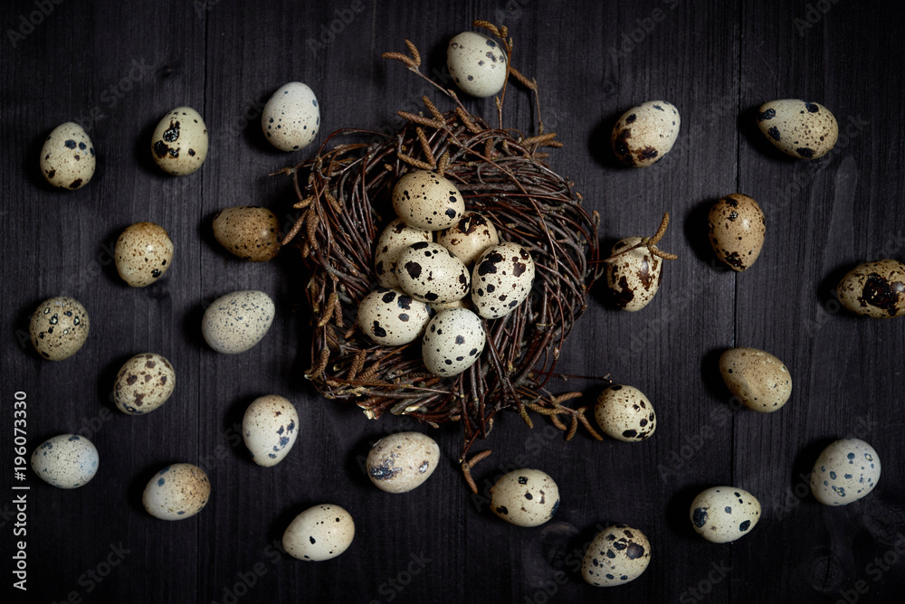 Quail eggs in nest on rustic wooden background, copy space. Healthy food concept. Top view, flat lay. Easter eggs. Happy Easter concept Quail eggs in nest on rustic wooden background, copy space. Healthy food concept. Top view, flat lay. Easter eggs. Happy Easter concept