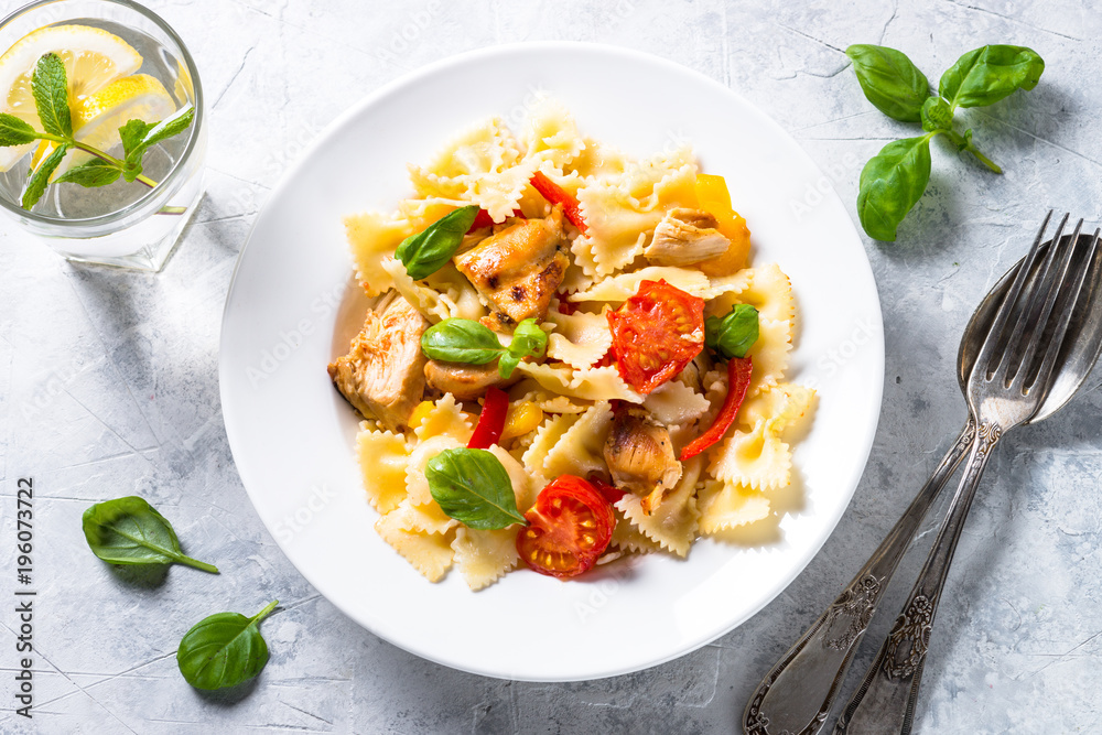 Pasta with chicken and vegetables top view. Pasta with chicken and vegetables top view.
