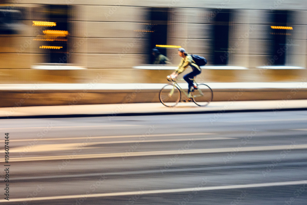 Motion Blur. Abstract Blur Picture of Male Cycling on Fixed Gear Bicycle in Night Cityscape, Speed Concept