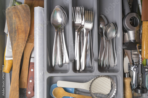 metal cutlery in the drawer. kitchenware photo