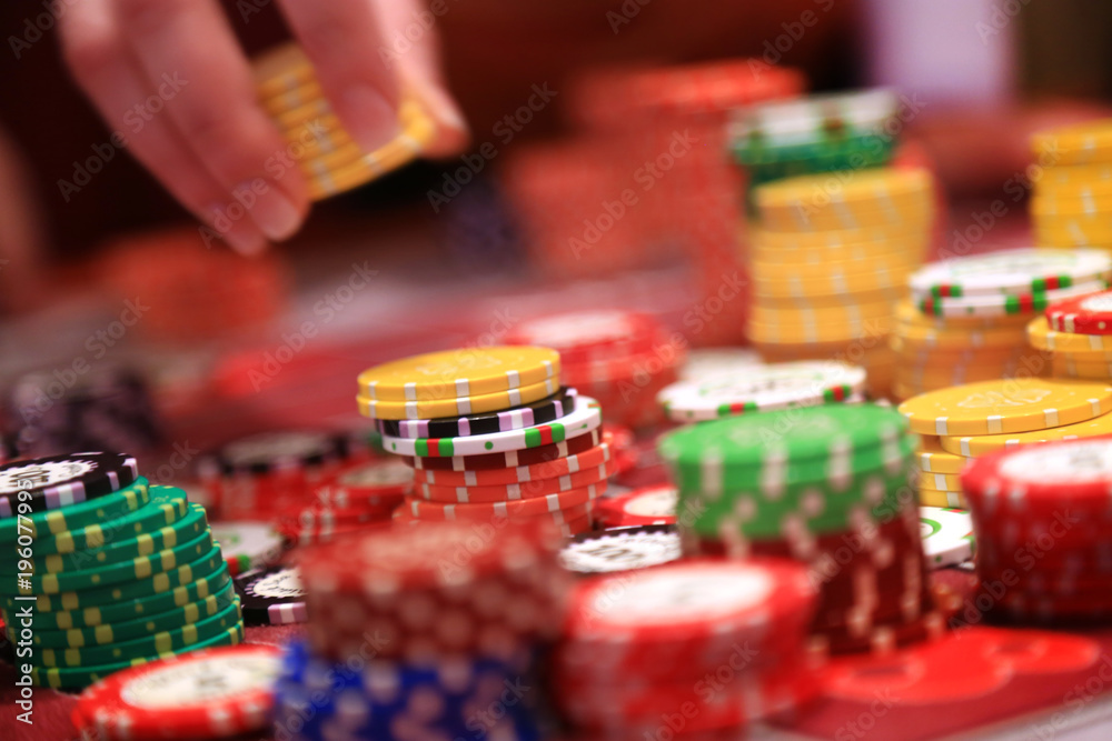 Player placing chips on a gambling table in casino Player placing chips on a gambling table in casino