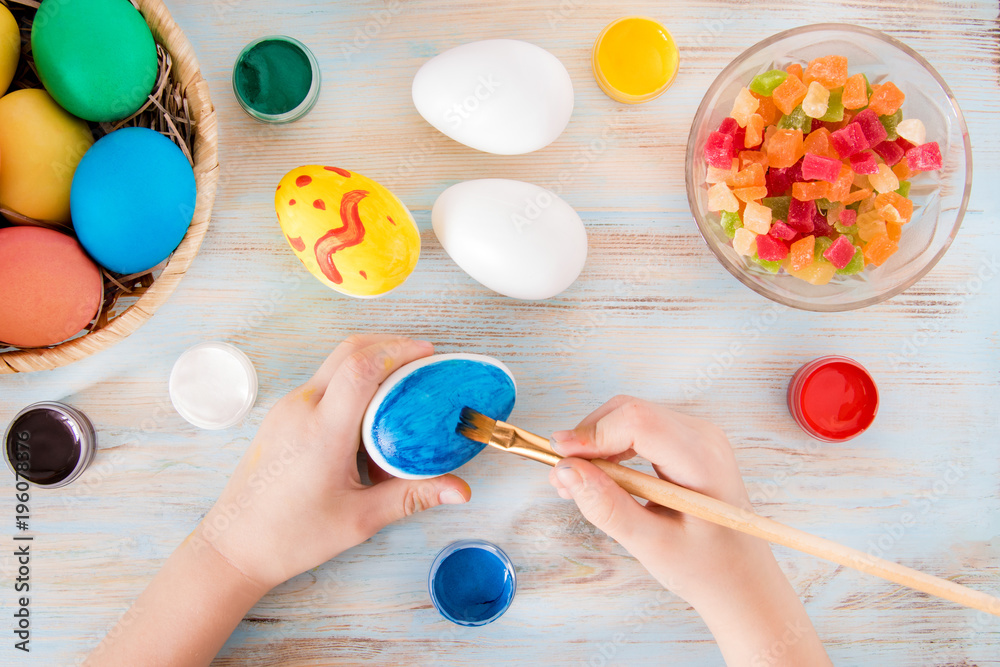 Easter crafts a little boy hands painted blue Easter egg - praparetion for easter Easter crafts a little boy hands painted blue Easter egg - praparetion for easter