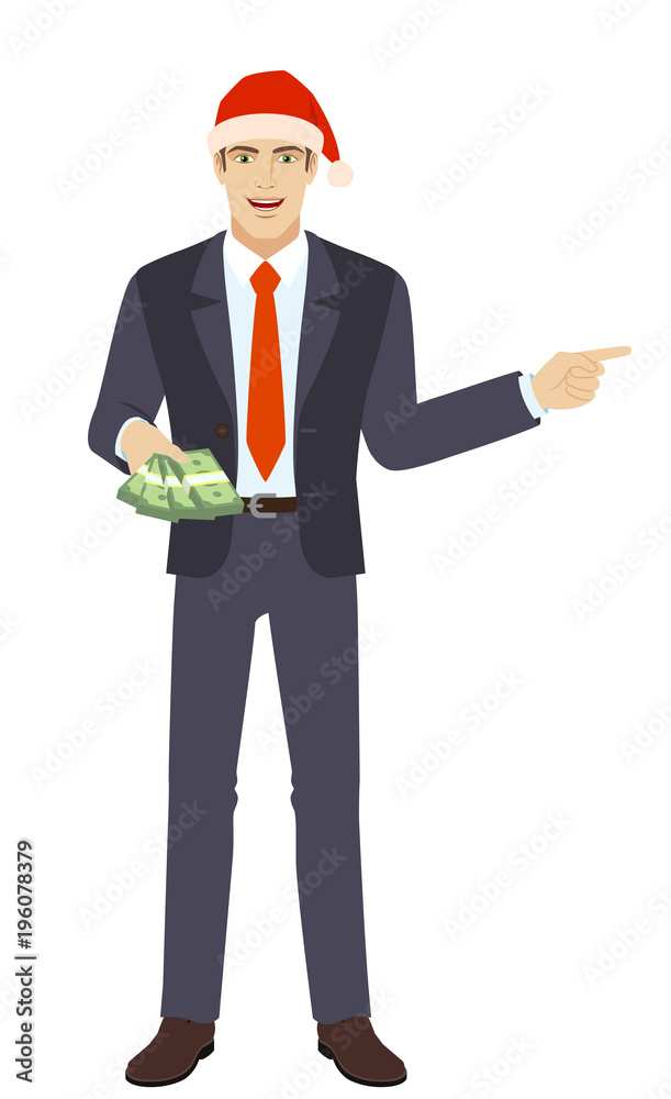 Businessman in Santa hat with money showing somewhere Businessman in Santa hat with money showing somewhere