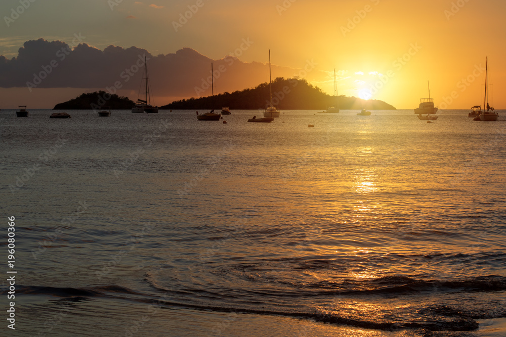Sunset over Caribbean sea in Guadeloupe. View from Malendure beach towards Ilet Pigeon and Reserve Cousteau