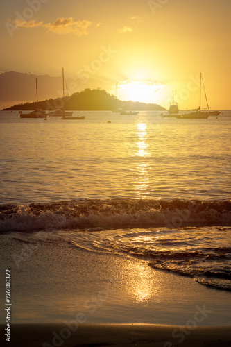 Sunset over Caribbean sea in Guadeloupe from Malendure beach photo