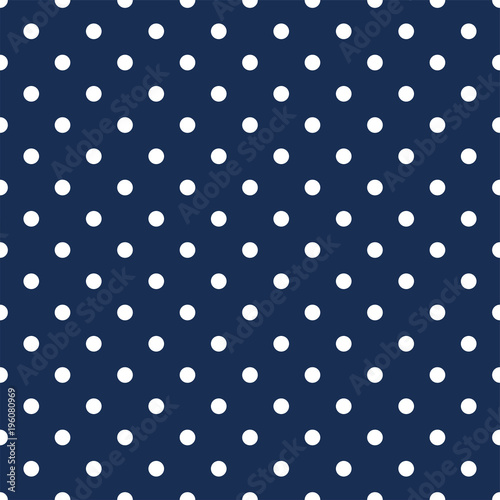 White polka dots on navy blue background