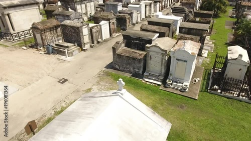 Mowing The Lawn In Old And Urban New Orleans Cemetery photo