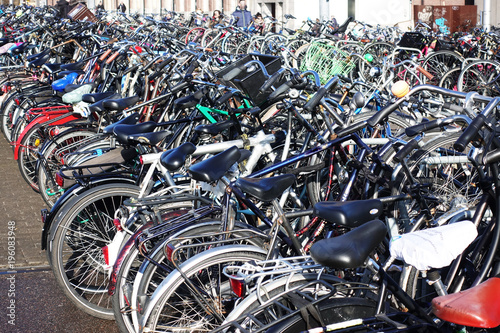 Many parked bicycles in the city centre of Amsterdam
