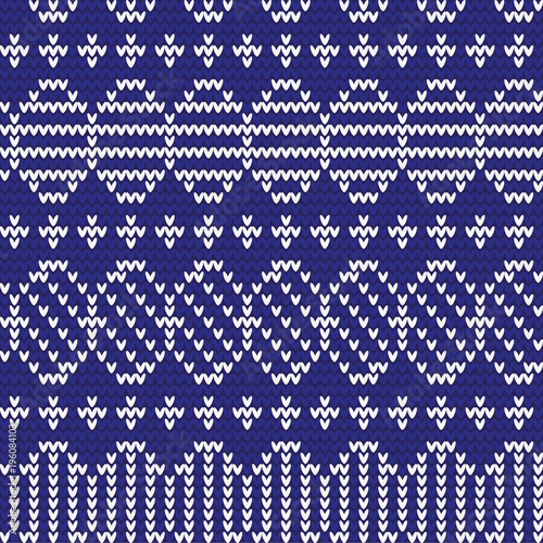 Knitted pattern of Easter eggs white on a blue background. Happy easter Greeting Card. Easter eggs on knitting pattern