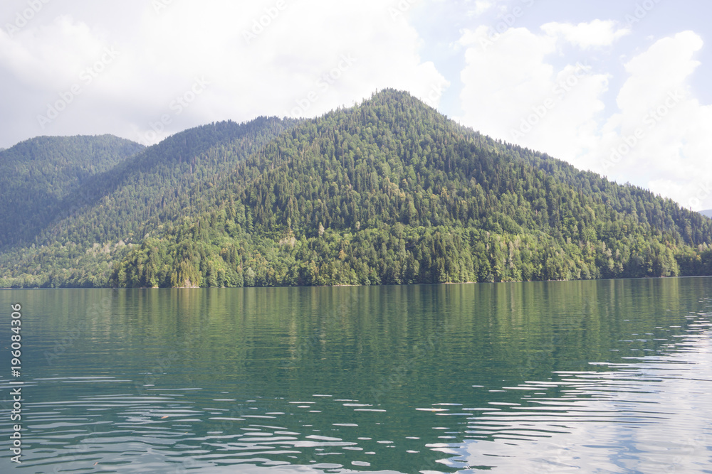Beautiful mountain lake Ritsa in Abkhazia. View of the lake from the Stalin cottage