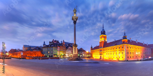 Panorama of Castle Square with Royal Castle, colorful houses and Sigismund Column called Kolumna Zygmunta in Old town during morning blue hour, Warsaw, Poland. photo