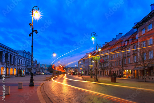 Krakowskie Przedmiescie street, part of the Royal Route in Old Town during evening blue hour, Warsaw, Poland.