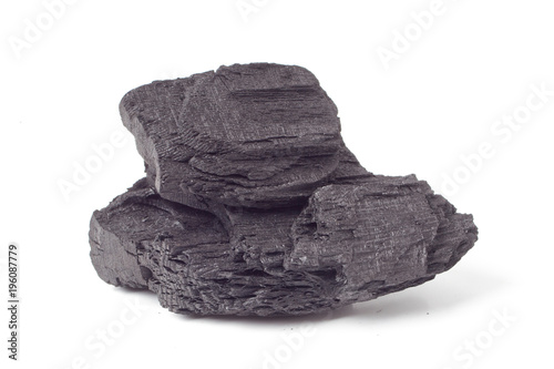 Charcoal. Pile of natural wood charcoal, traditional charcoal or hardwood charcoal, on white background