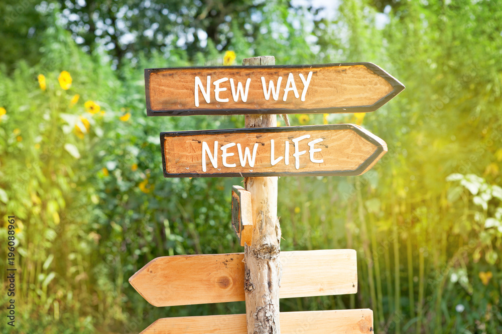 Wooden direction sign: NEW WAY, NEW  LIFE